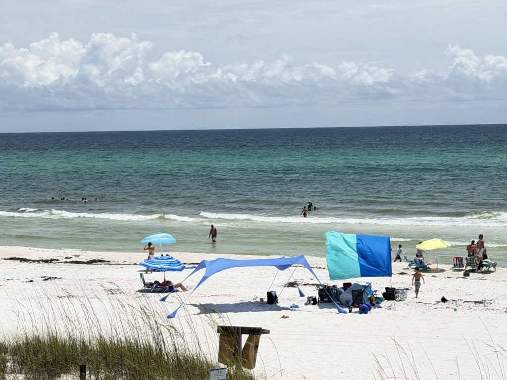 Pet-Friendly Panama City Beach Guide for Barefoot Paradise Guests Stunning view of the emerald waters and white sand beach from Barefoot Paradise in Panama City Beach.